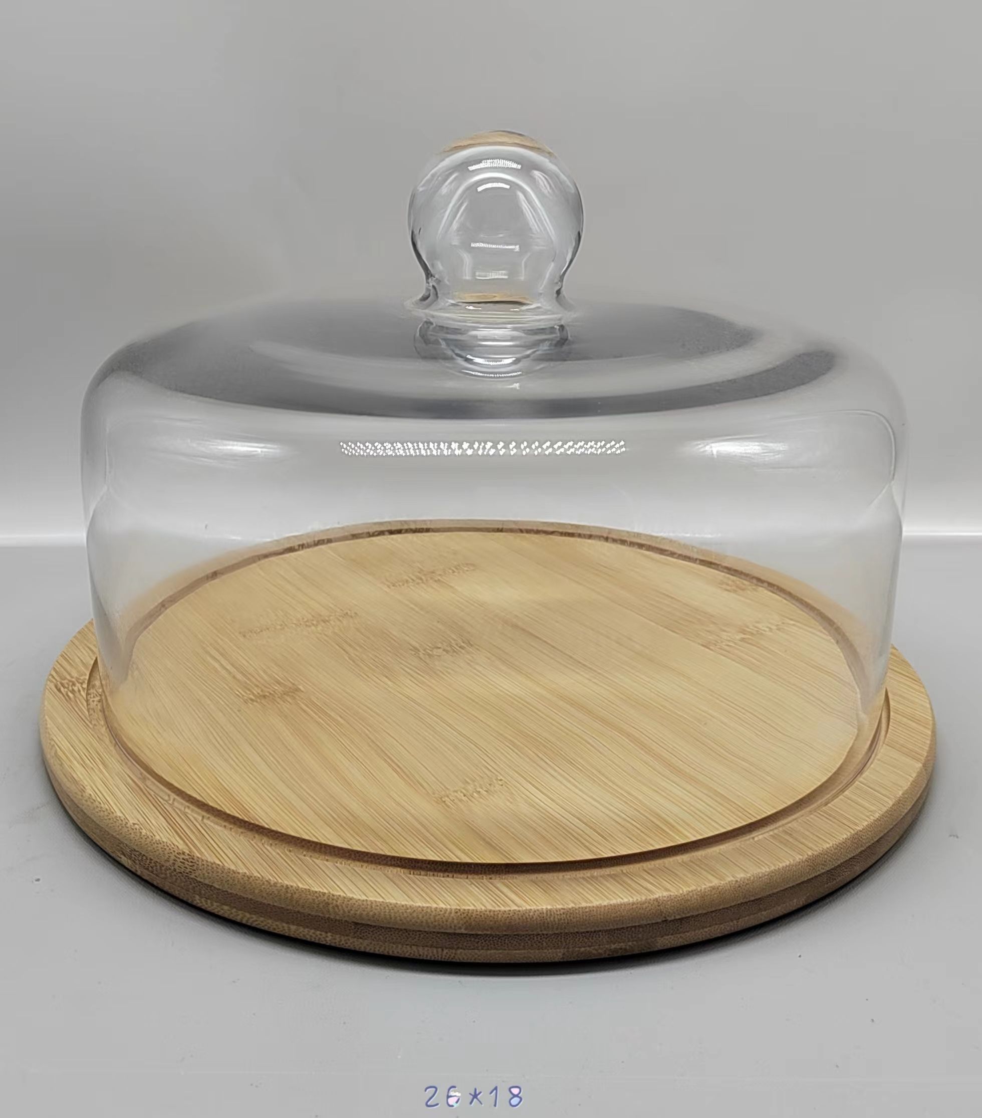 Clear glass jar with wooden base 