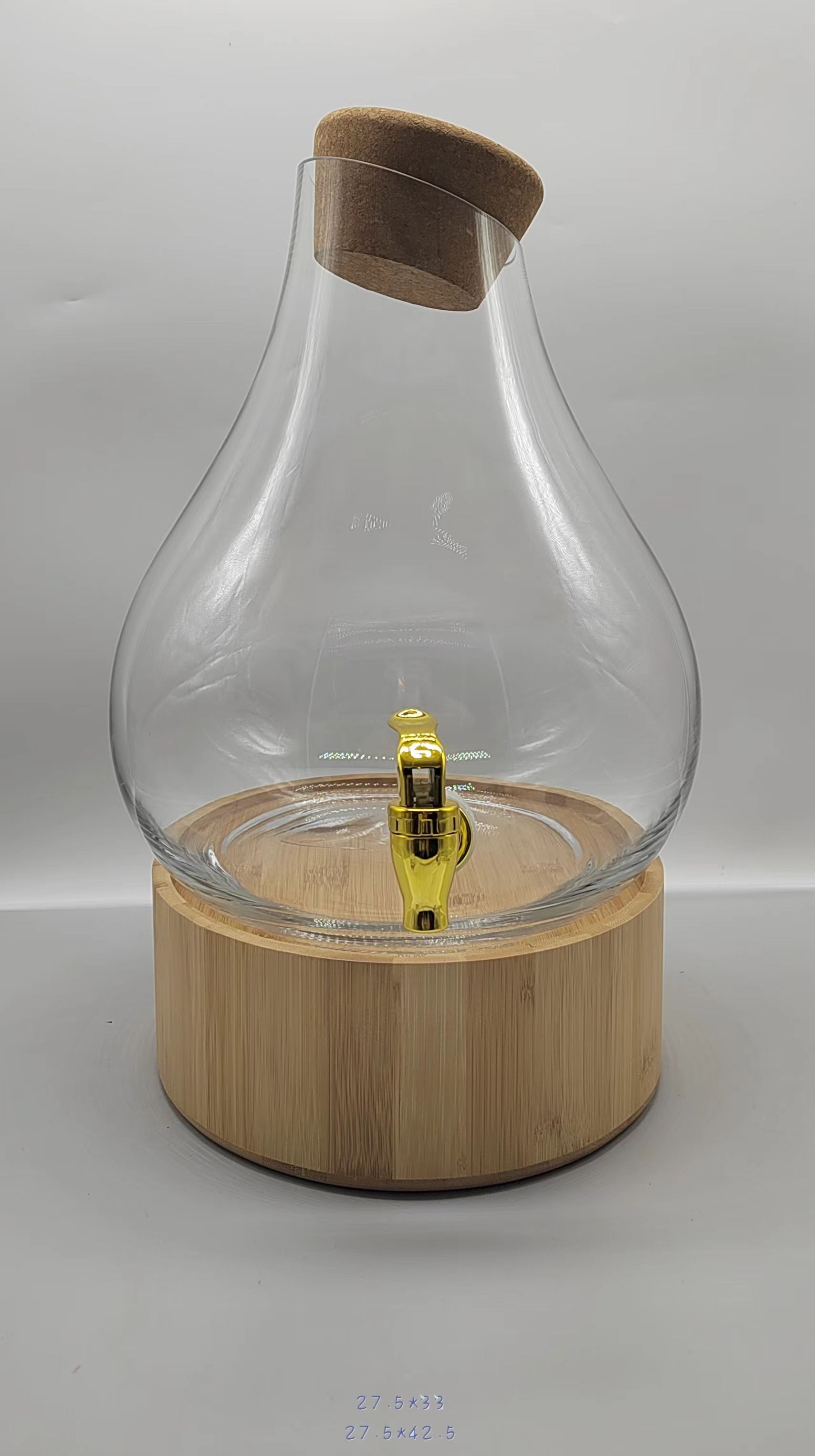 Clear glass juice jar with wooden lid and wooden base