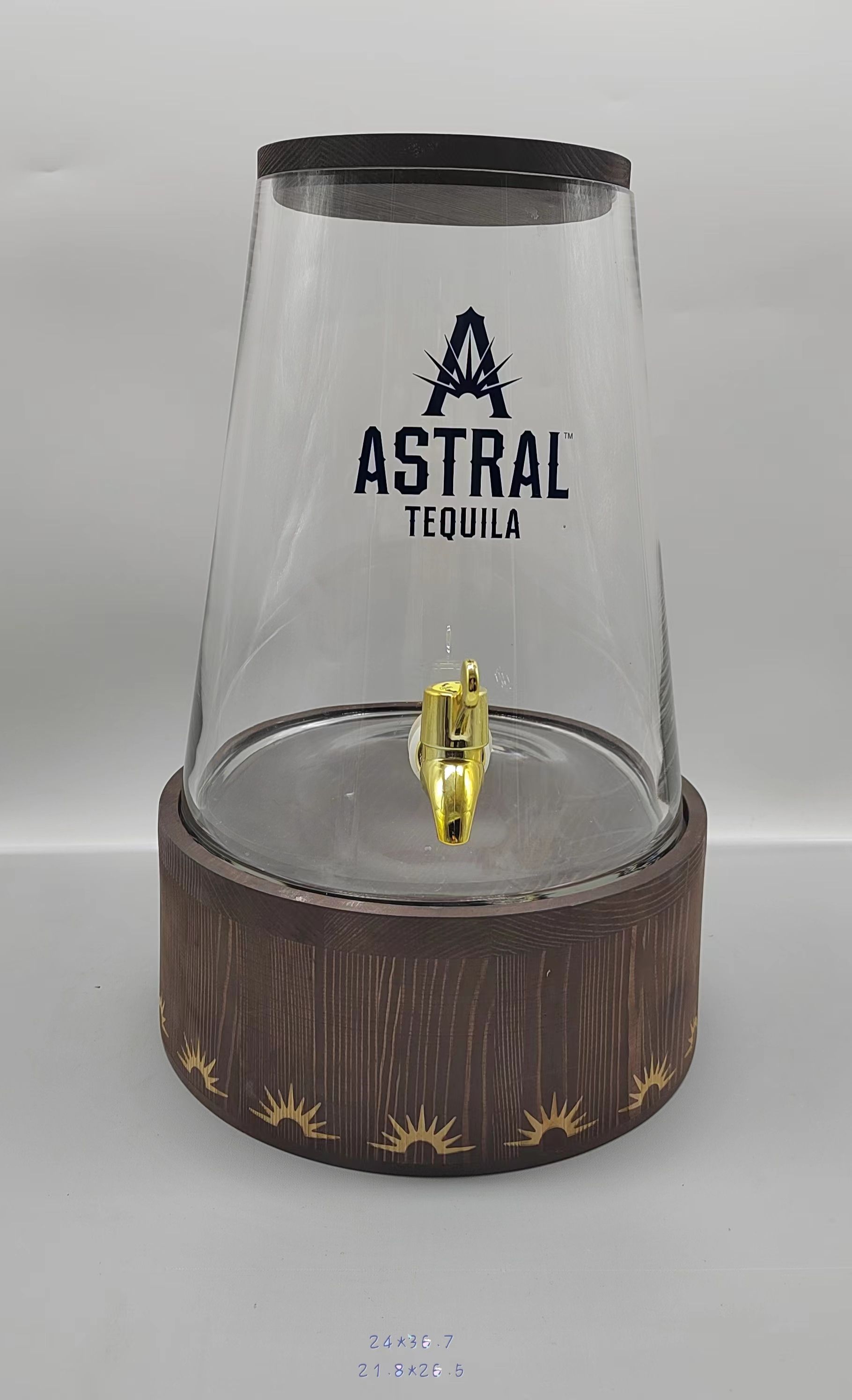 Clear glass juice jar with wooden lid and wooden base