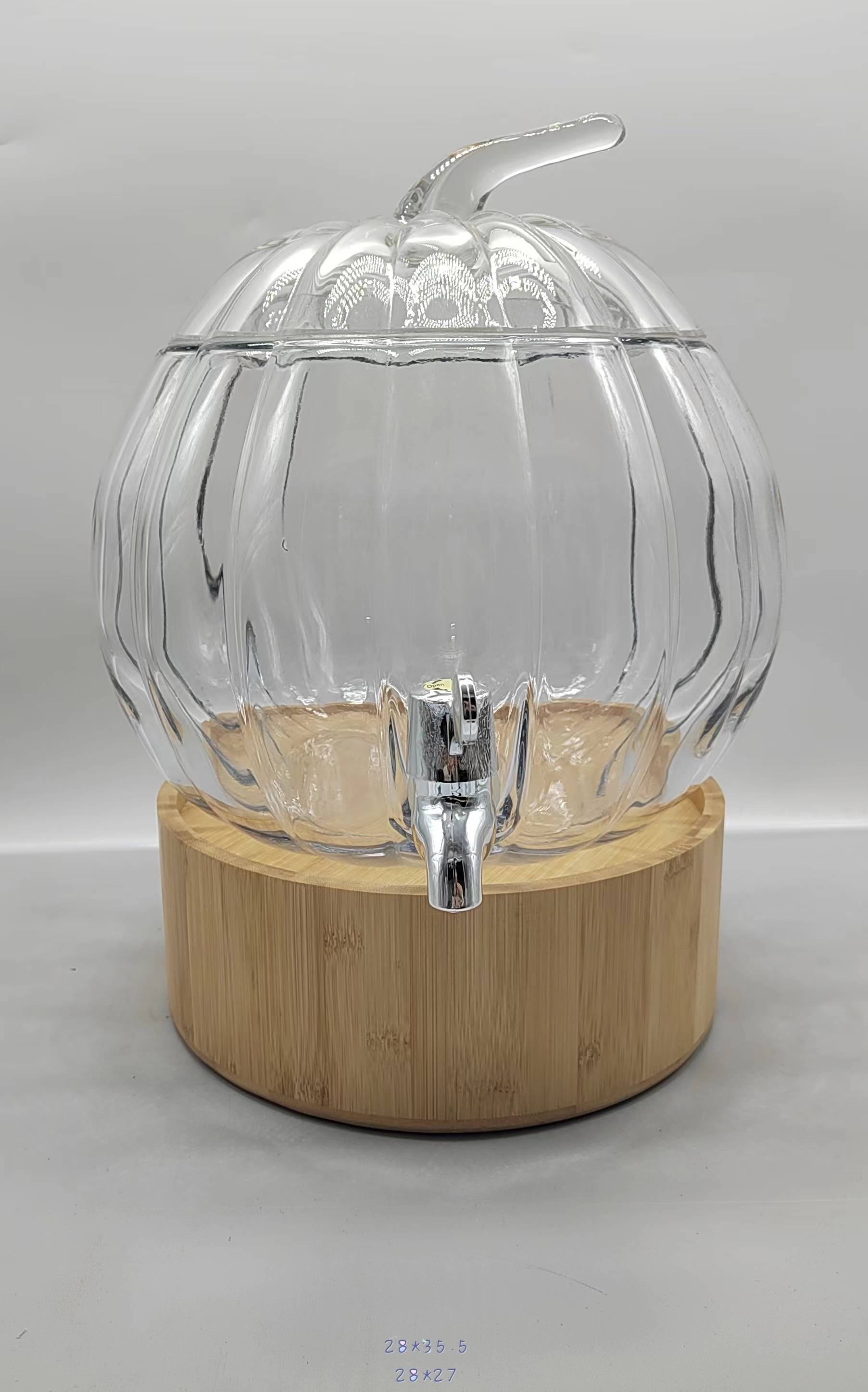 Clear glass juice jar with wooden base