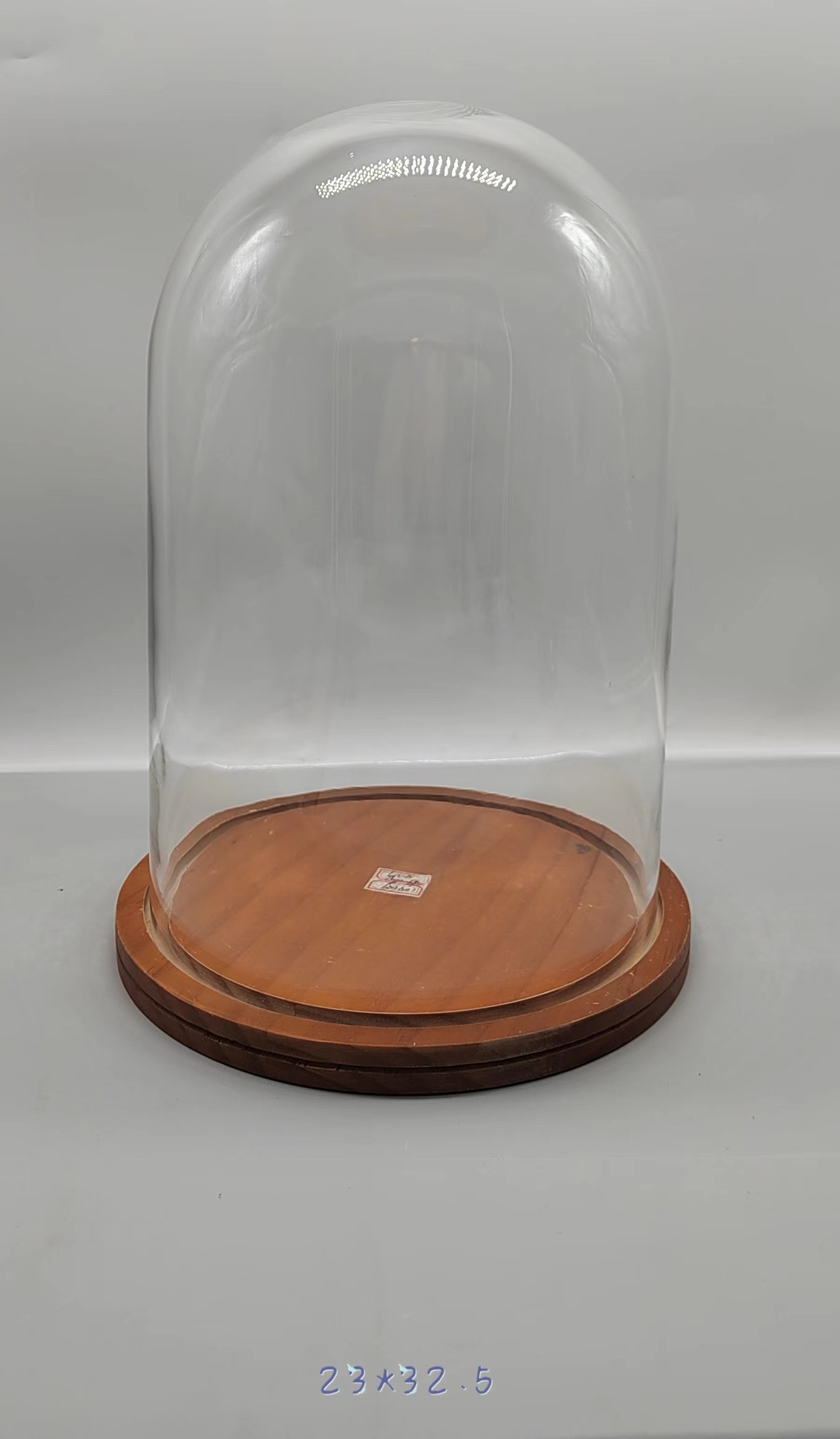 Clear glass jar with wooden base 