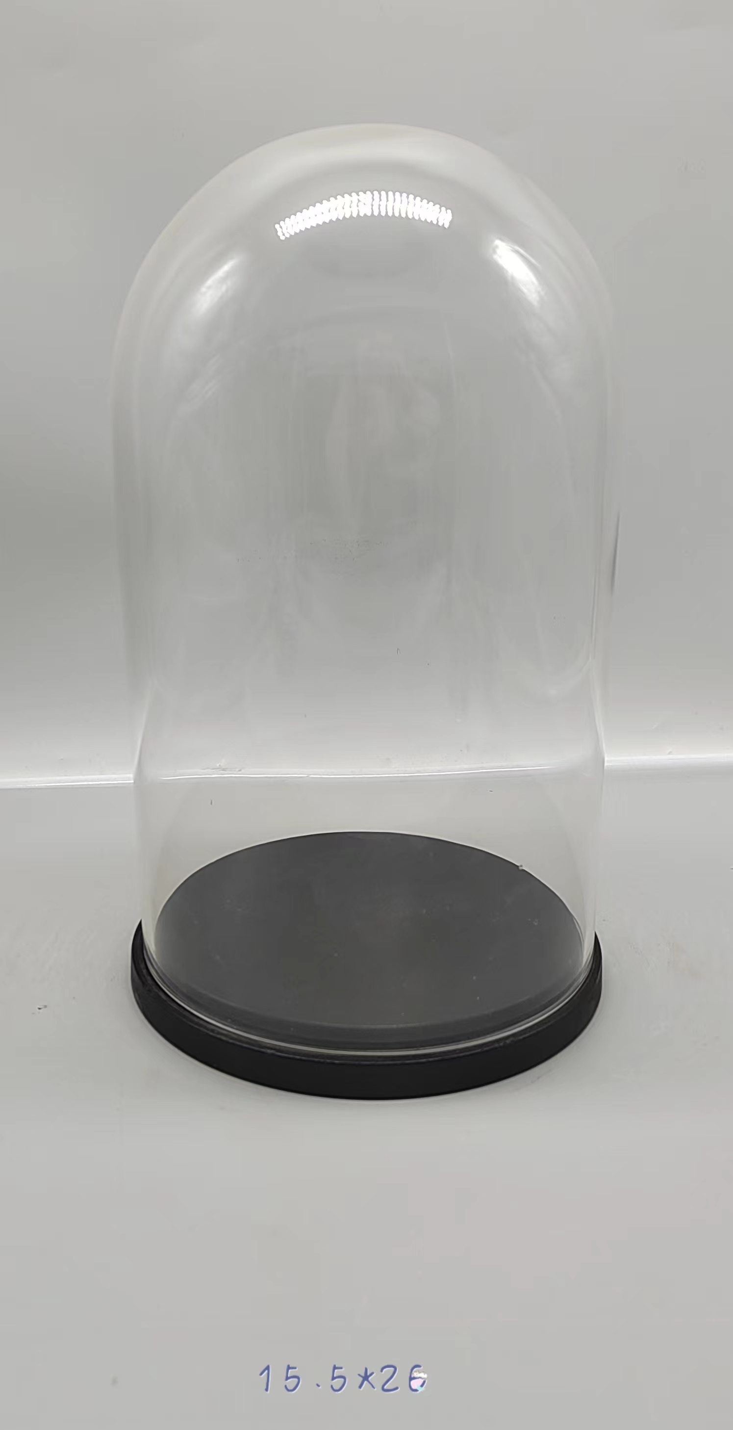 Clear glass jar with wooden base 