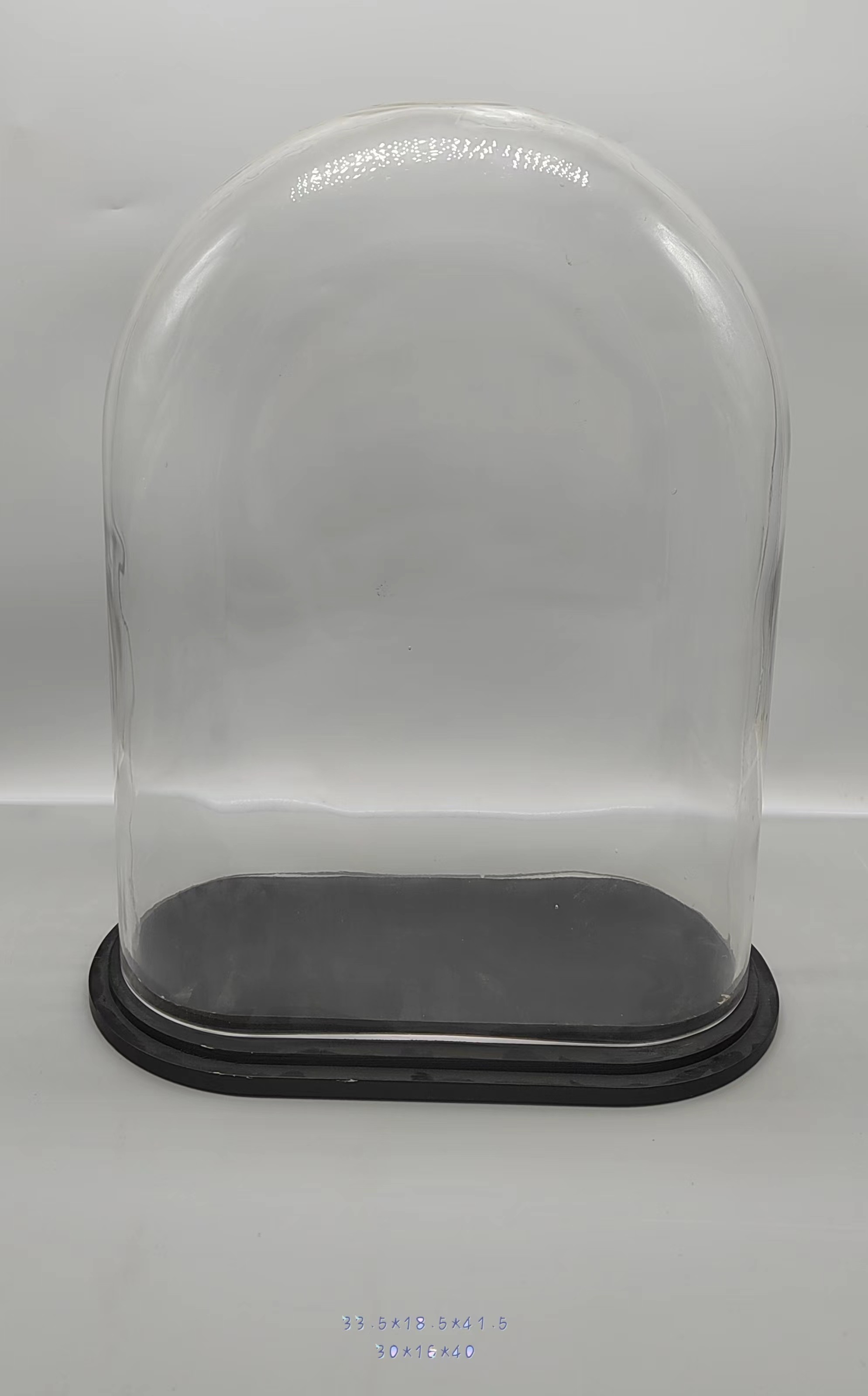 Clear glass jar with wooden base 