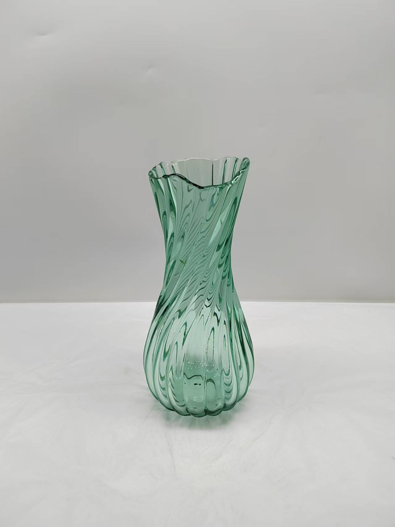 Green glass vase in primary color