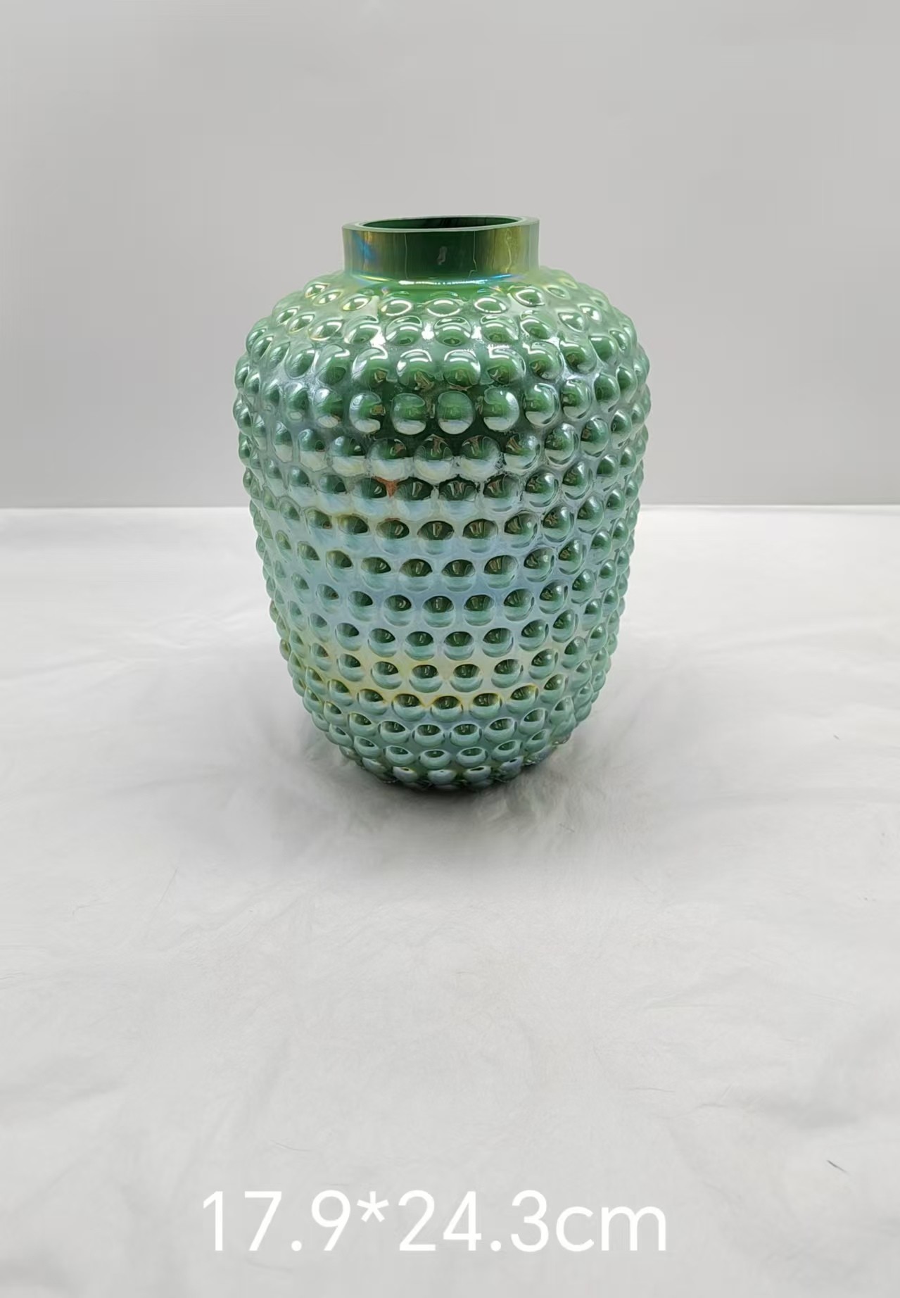 Green glass vase with dot in primary color